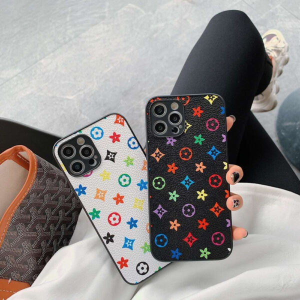 Person Holding Two DHGadges iPhone Cases in Black and White