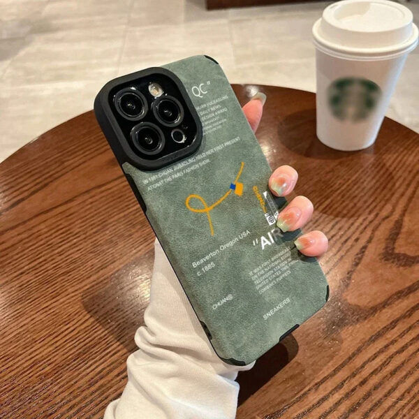 Green sneaker-themed case held in hand