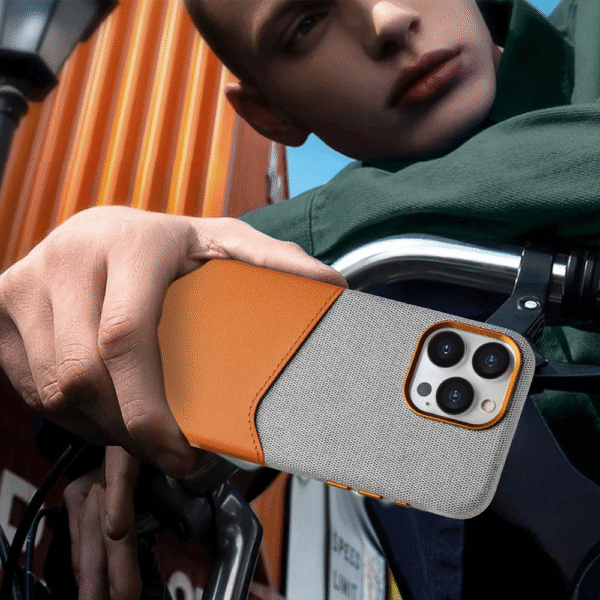 Man Holding Card Holder MagSafe iPhone Leather Case Outdoors