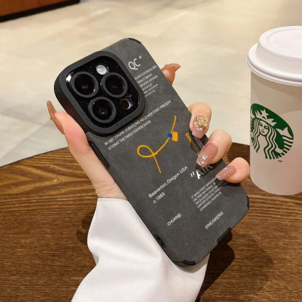Gray case held in hand with full view of print