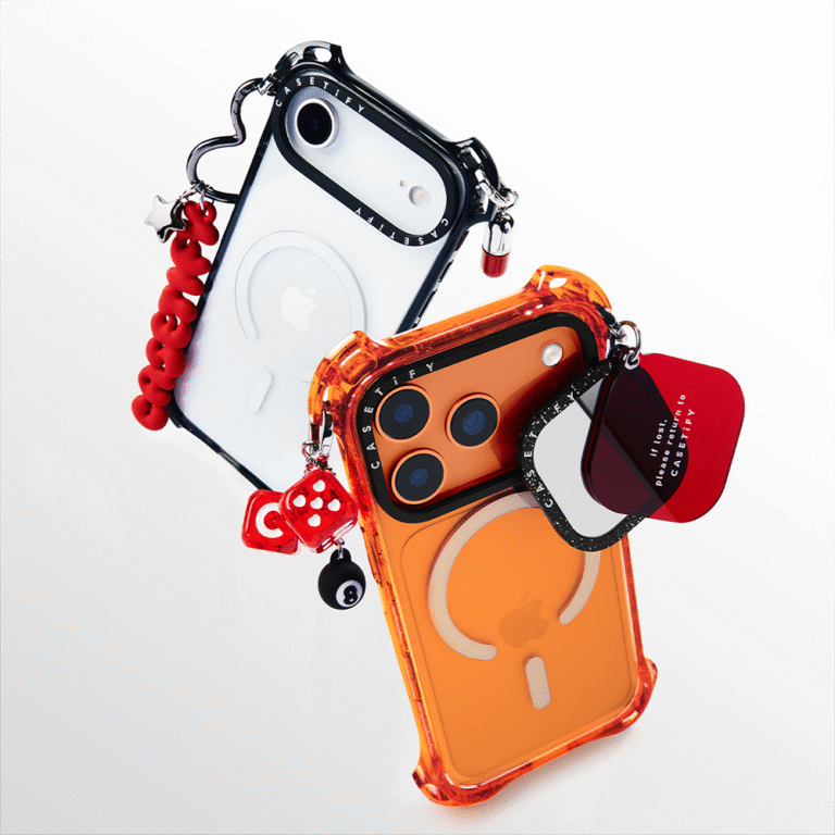 Lifestyle photo of white and orange Casetify Bounce Cases with charms