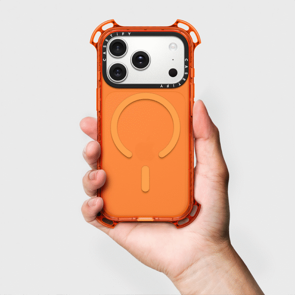 Casetify Bounce Case orange variant held in hand with MagSafe ring