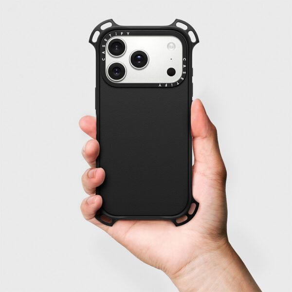 Black Casetify Bounce Case in hand with solid black back panel